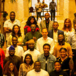 Cross-section of men and women smiling at the camera